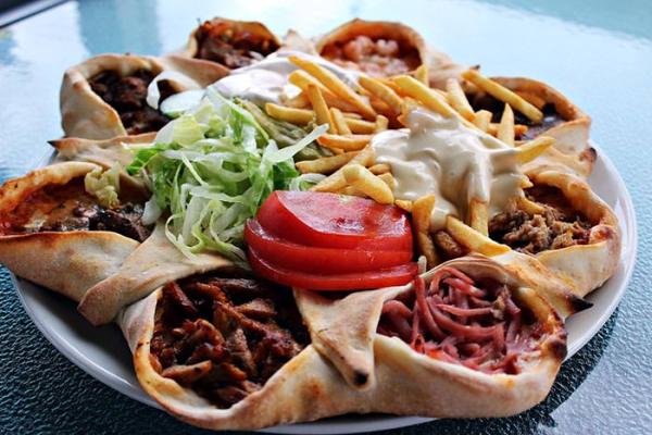 Lebanese wrap platter with grilled meat, chips, shredded lettuce and tomato