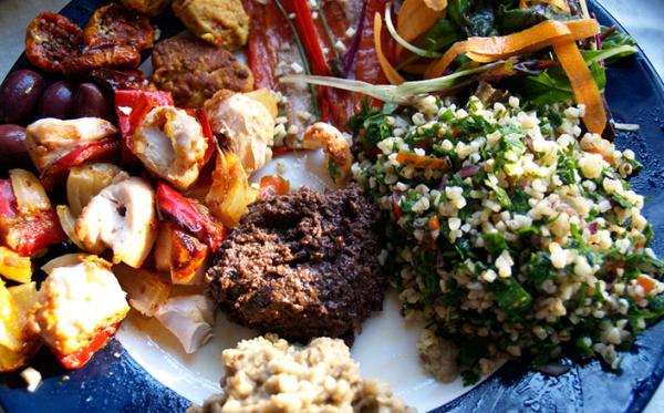 Lebanese mezze platter with tabouli, falafel, hummus, roasted vegetables and olives