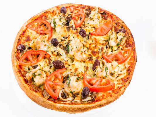 Vegetarian pizza topped with tomato slices, olives, artichokes, herbs and melted cheese