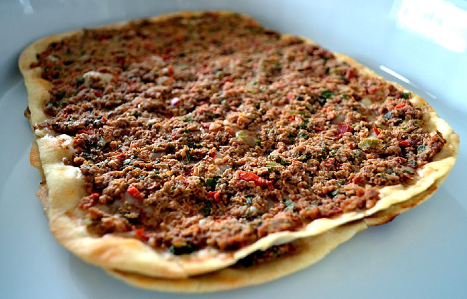 Freshly baked Lebanese lahembajin flatbread topped with seasoned minced meat