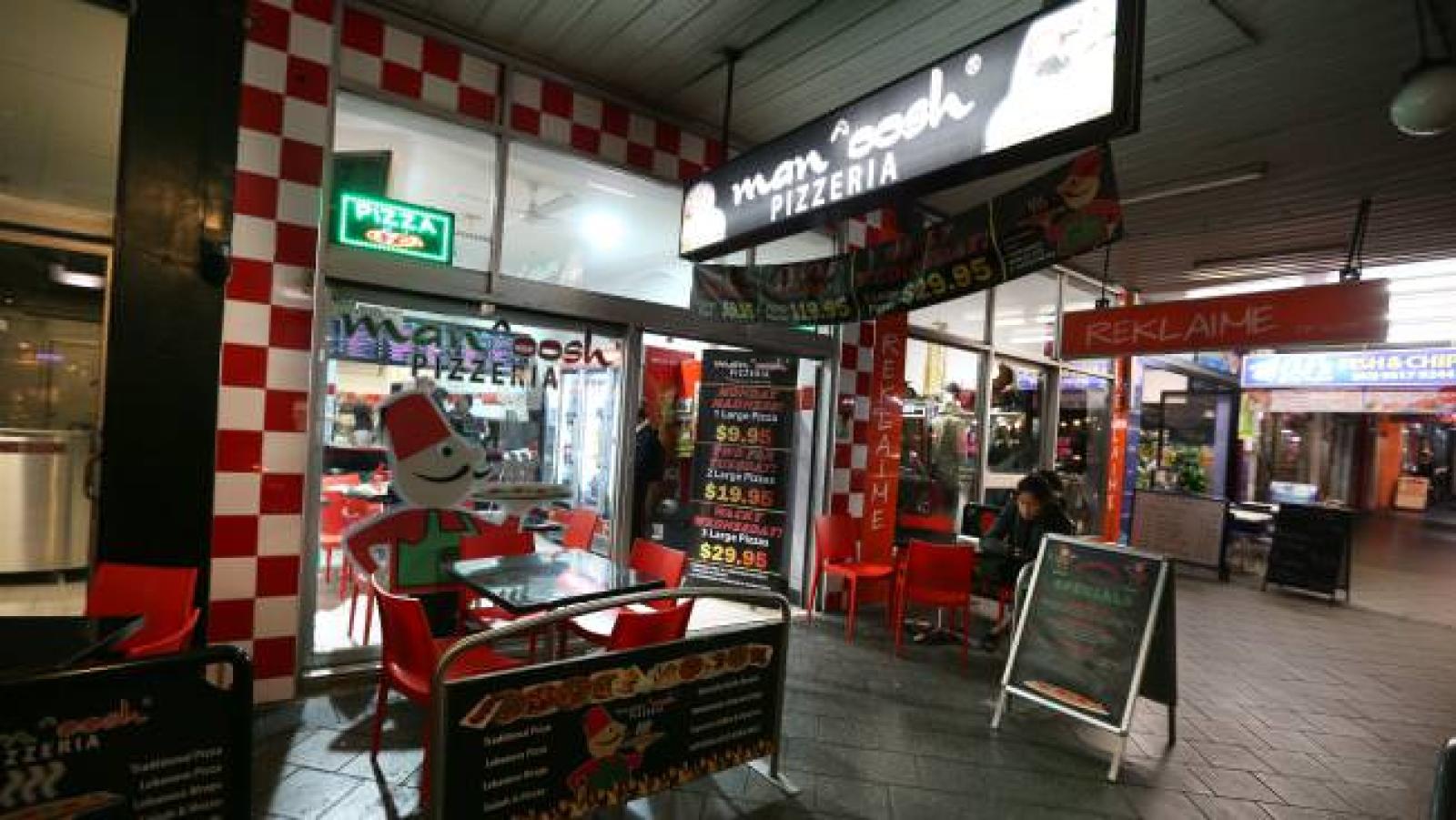 OOSHMAN Lebanese pizza takeaway storefront with indoor seating and menu displays