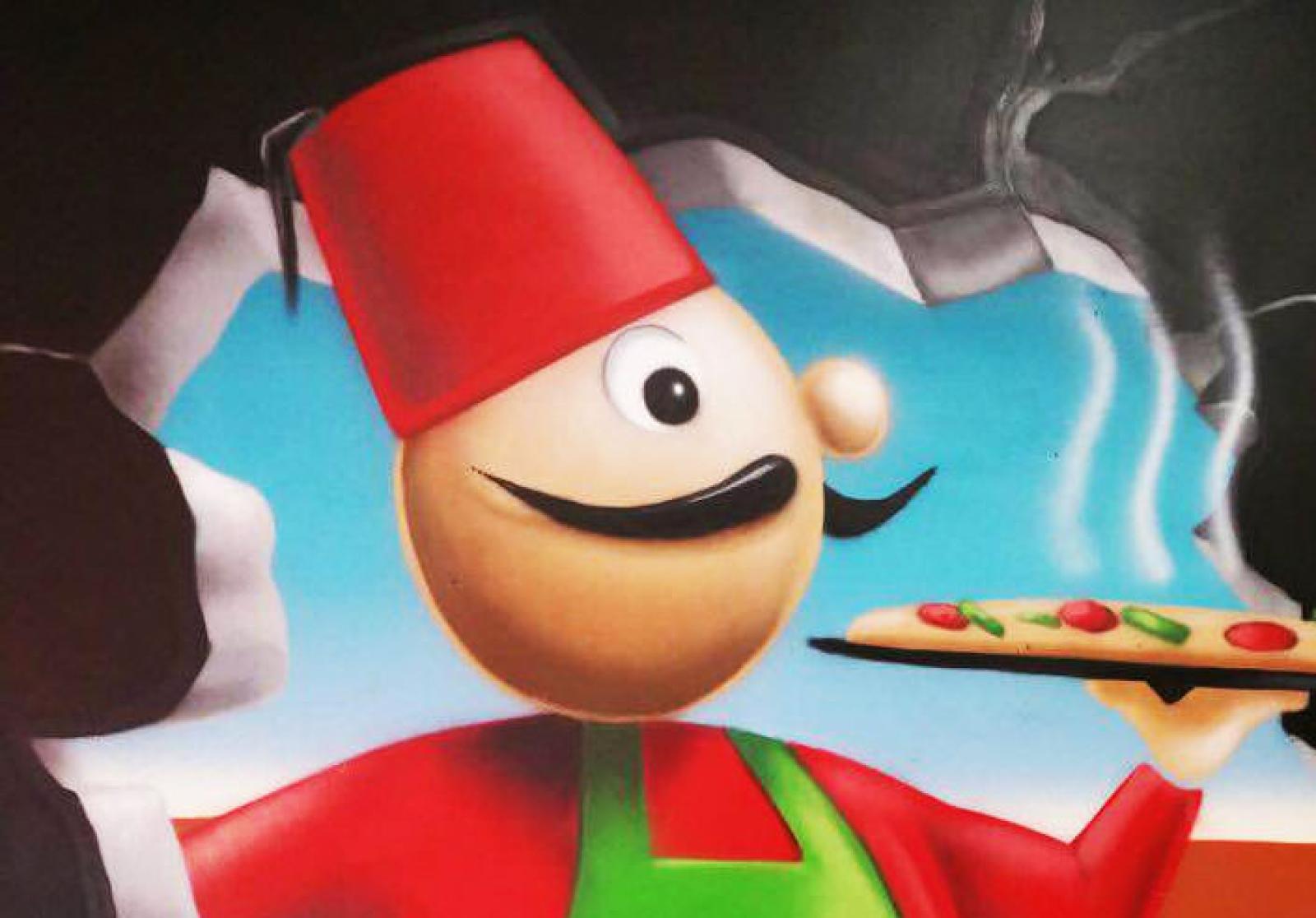 OOSHMAN mascot in a red fez holding a freshly topped pizza against a blue mural background