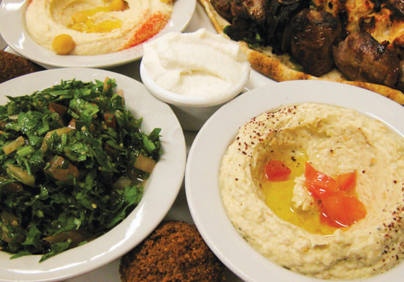 Lebanese mezze spread with hommus, labneh, tabouli, kebbeh and grilled meat