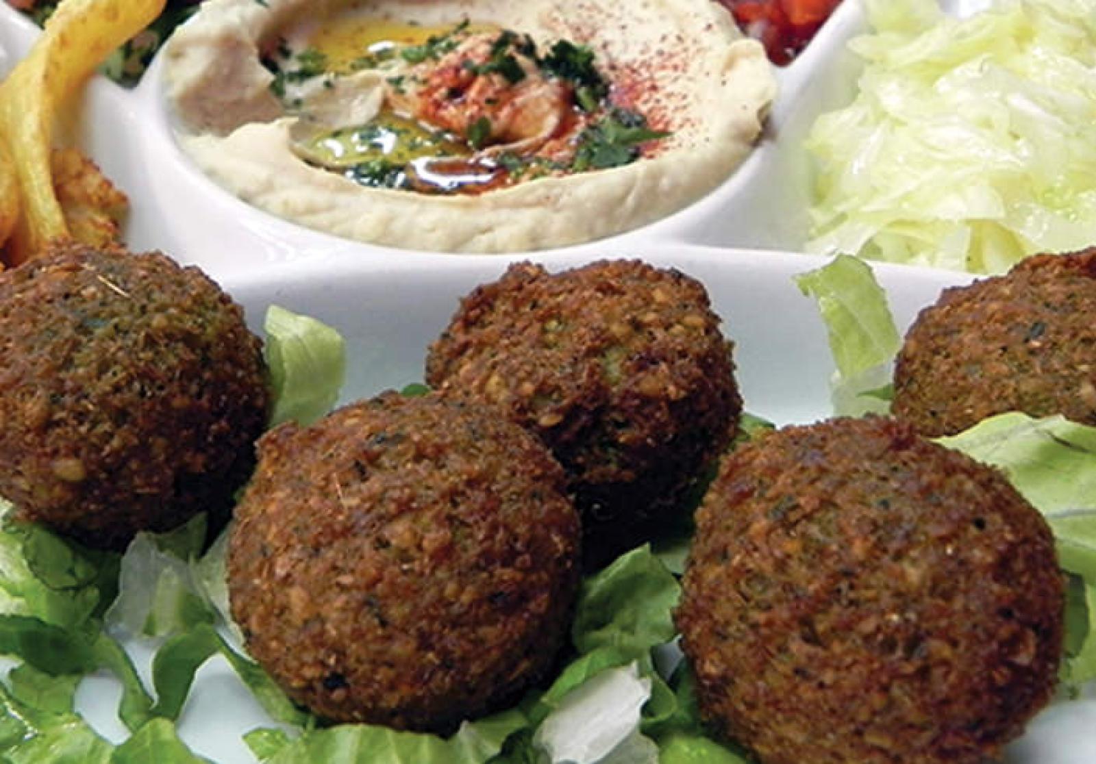 Crisp falafel balls served with creamy hommus, salad leaves and chips