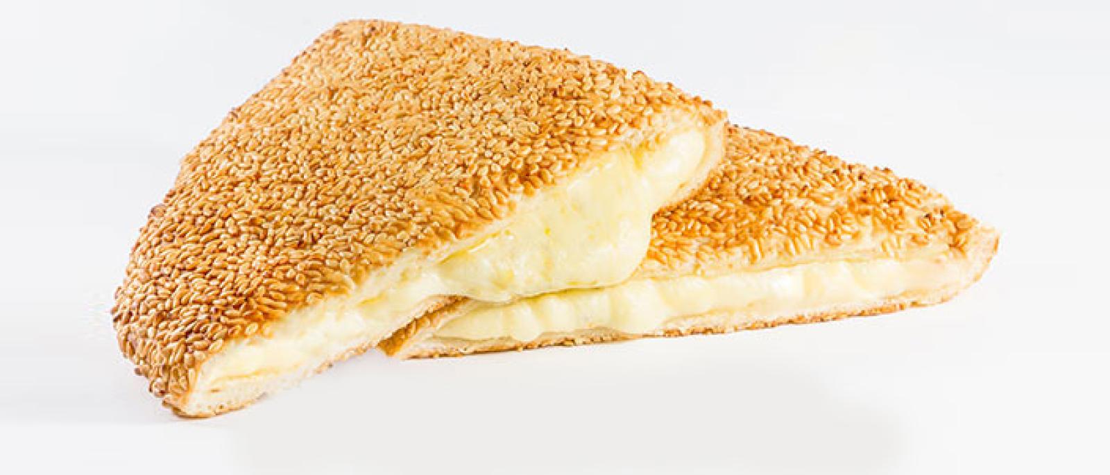 Sesame-crusted cheese pastry with a warm, melted cheese filling