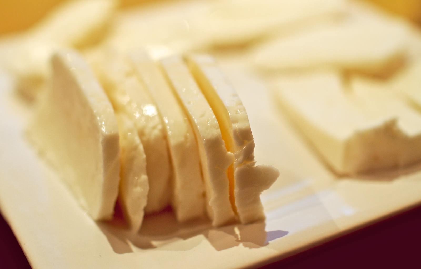 Close-up of sliced white cheese arranged on a plate