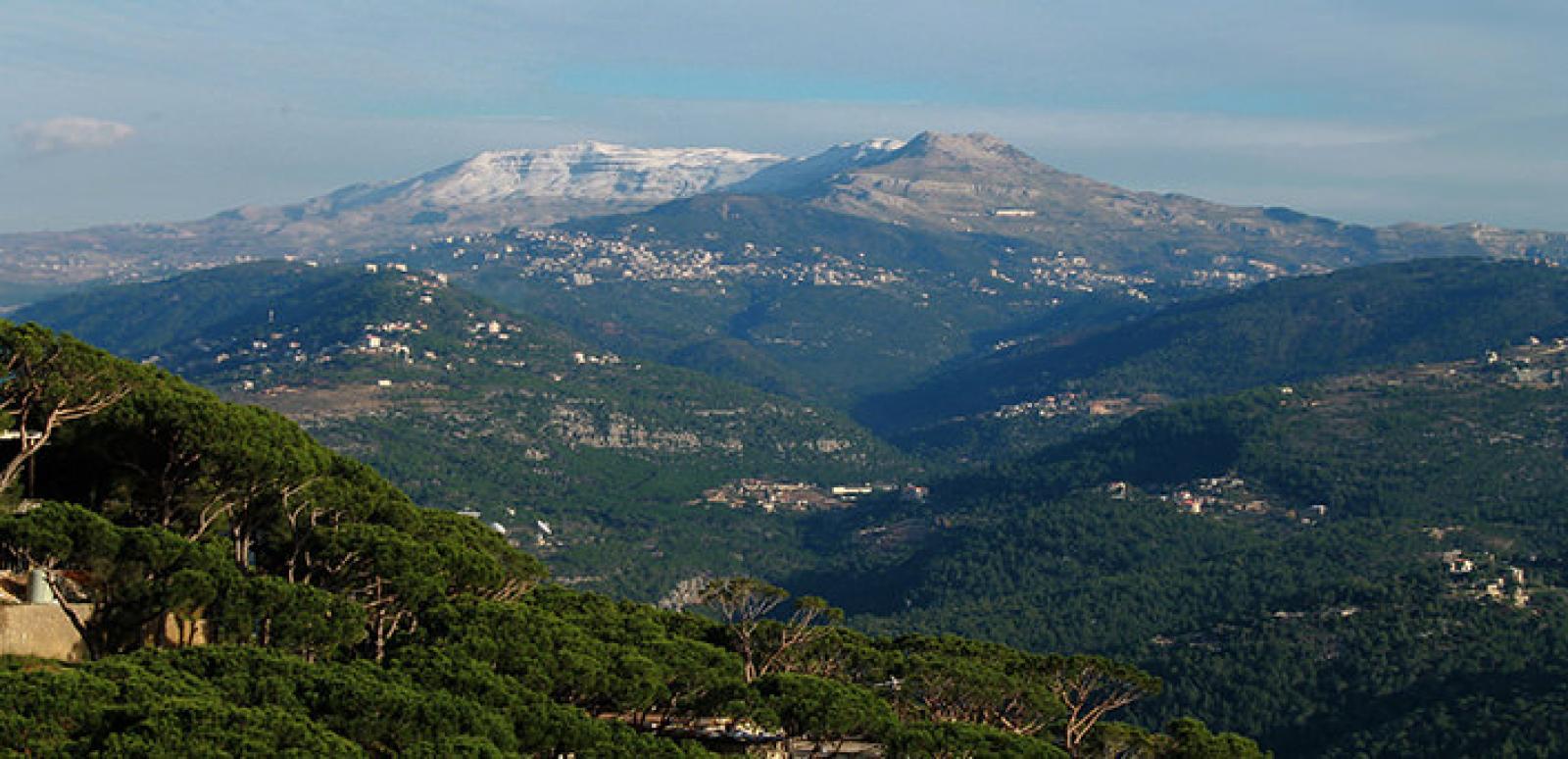 Green mountain valleys and hillside villages in the Lebanese countryside