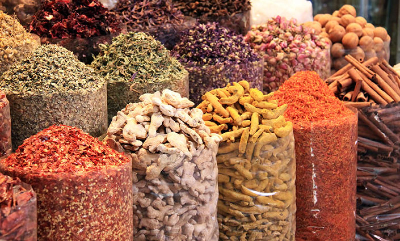Colourful sacks of dried spices, herbs, chillies and cinnamon at a Middle Eastern market